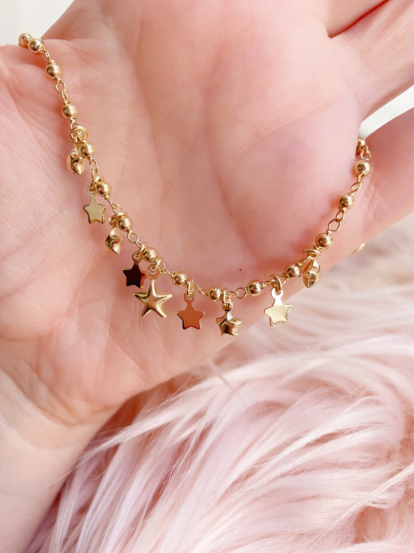 Bracciale palline con stelle bombate e in lastra