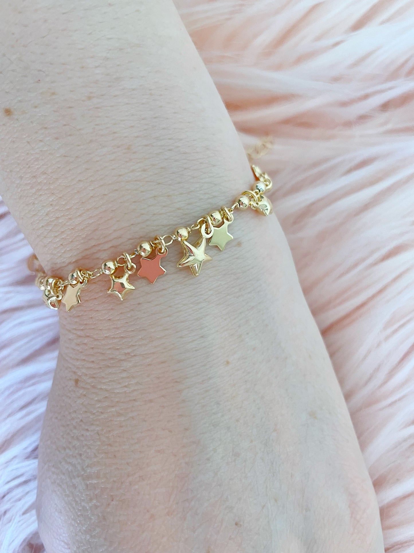 Bracciale palline con stelle bombate e in lastra