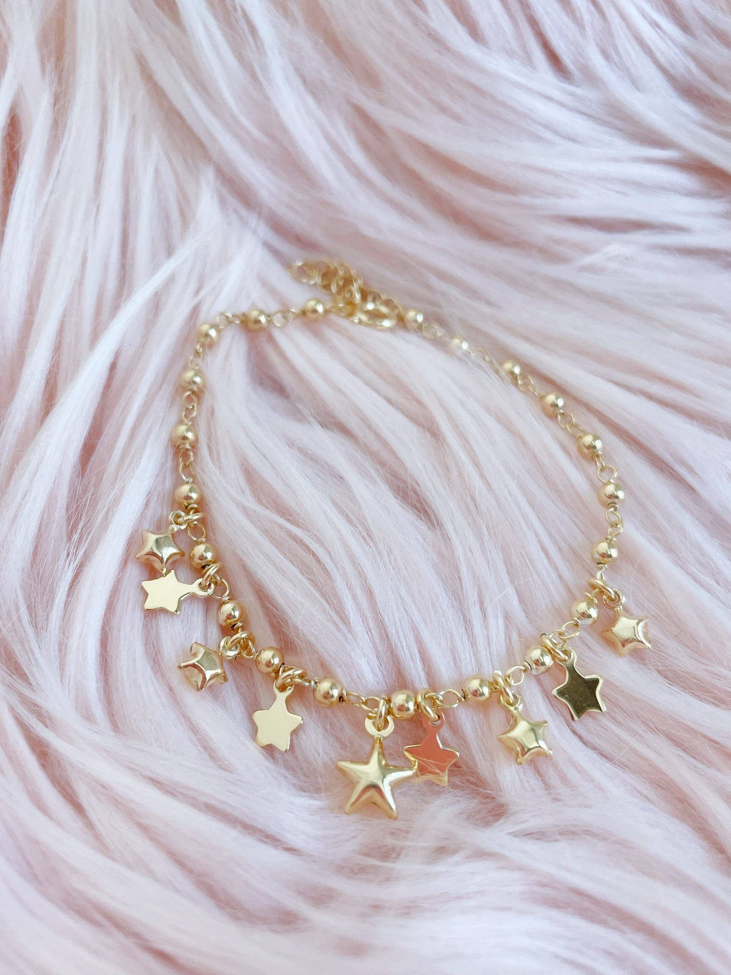 Bracciale palline con stelle bombate e in lastra